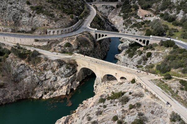 an aerial view of a bridge over a river