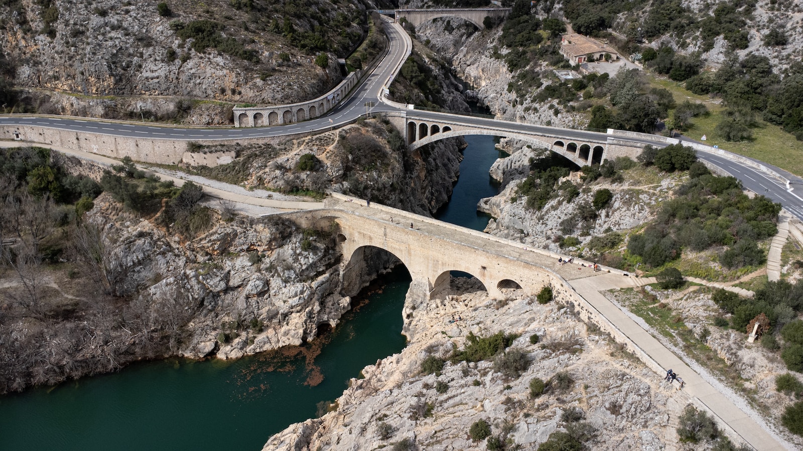 an aerial view of a bridge over a river