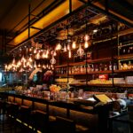 turned-on filament bulb lights at bar counter